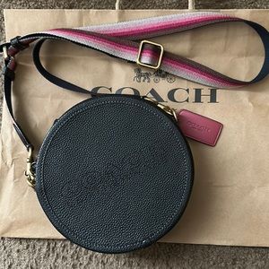 Round Coach Crossbody.